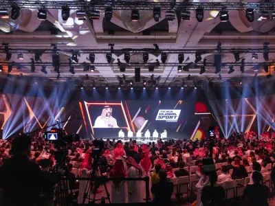 Main stage panel session at NGSC with full audience and lighting effects, showcasing esports leadership and industry innovation in Riyadh