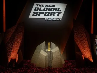 The New Global Sport Conference monument structure displayed at the event entrance with spotlight and branding