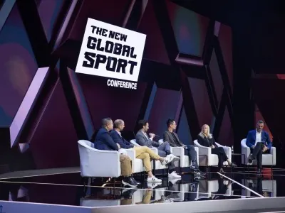 Panel discussion with industry leaders during NGSC 2025 under branded backdrop